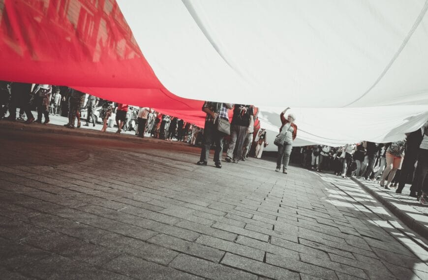 people under white and red textile