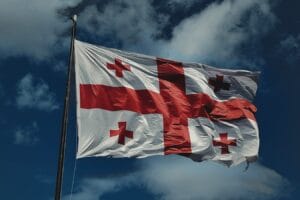 A flag flying in the wind on a cloudy day