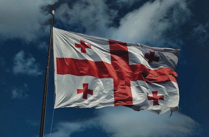 A flag flying in the wind on a cloudy day