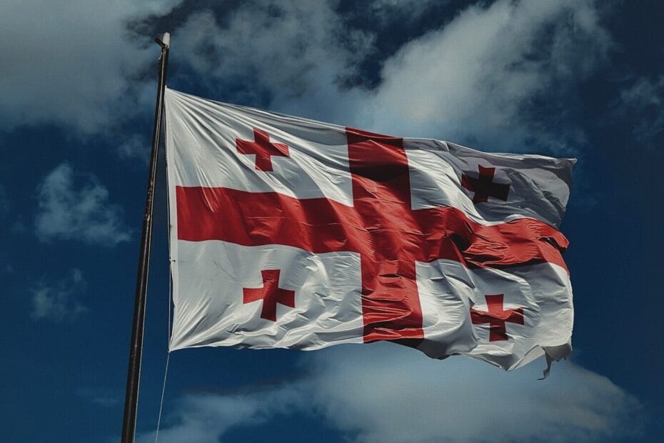 A flag flying in the wind on a cloudy day